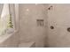 Modern tiled shower with a built-in niche and sleek fixtures at 5237 N 106Th Ave, Glendale, AZ 85307