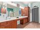 Bathroom featuring double sinks, wood cabinets, and tiled floor at 5314 W Bowker St, Laveen, AZ 85339