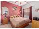 Cozy bedroom with ceiling fan, mirror and dresser at 5314 W Bowker St, Laveen, AZ 85339