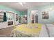 Bright and large main bedroom showcasing a bed and entertainment center with fireplace at 5314 W Bowker St, Laveen, AZ 85339