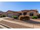 Charming single-story home showcasing its desert landscaping, neutral color palette and welcoming curb appeal at 5314 W Bowker St, Laveen, AZ 85339