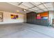 Spacious garage featuring ample storage cabinets, painted walls, and concrete flooring at 5314 W Bowker St, Laveen, AZ 85339
