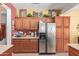 Spacious kitchen featuring stainless steel refrigerator and generous cabinet space at 5314 W Bowker St, Laveen, AZ 85339