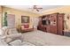 Inviting living room with sofas, entertainment center, carpet, and a ceiling fan at 5314 W Bowker St, Laveen, AZ 85339