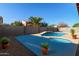Backyard swimming pool and spa area with tiled accents, perfect for relaxation and outdoor entertaining at 5314 W Bowker St, Laveen, AZ 85339