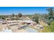 An aerial view of a home with a pool, sheds, and other outbuildings in the backyard at 6329 E Voltaire Ave, Scottsdale, AZ 85254