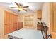 Bedroom with a ceiling fan, a window, tile floors, a closet, and wood-trimmed accents at 6329 E Voltaire Ave, Scottsdale, AZ 85254