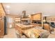 Gourmet kitchen features a large island with cooktop, custom cabinets, granite counters, and stainless appliances at 6329 E Voltaire Ave, Scottsdale, AZ 85254