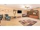 Comfortable living room features a ceiling fan, tiled floors, and ample seating at 6329 E Voltaire Ave, Scottsdale, AZ 85254