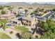 Aerial view of a Southwestern home showcasing a landscaped backyard, pool, and beautiful mountain views at 6922 S Black Hills Way, Chandler, AZ 85249