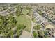 An aerial shot of a lush green park and walking path nestled within a vibrant community at 6922 S Black Hills Way, Chandler, AZ 85249