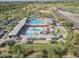 Aerial view of community pool featuring water slides, a lazy river and large swimming pool at 6922 S Black Hills Way, Chandler, AZ 85249