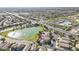 Aerial view featuring a lake next to homes, parks, and shopping areas in a vibrant community at 6922 S Black Hills Way, Chandler, AZ 85249
