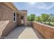 A balcony with a view of mature trees and grassy green space at 6922 S Black Hills Way, Chandler, AZ 85249