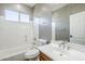 Bathroom featuring a shower-tub combo, a decorative mirror, and a single-sink vanity at 6922 S Black Hills Way, Chandler, AZ 85249
