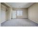 Bedroom with carpet, window, closet, and entry door at 6922 S Black Hills Way, Chandler, AZ 85249