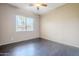 Bedroom featuring hardwood floors, a ceiling fan, blinds, and a window view at 6922 S Black Hills Way, Chandler, AZ 85249