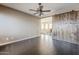 Bedroom featuring hardwood floors, a rustic barn door, and a view to the upstairs hallway at 6922 S Black Hills Way, Chandler, AZ 85249
