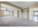Bonus room with carpet, open floor plan, and natural light at 6922 S Black Hills Way, Chandler, AZ 85249