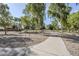 Scenic community park featuring walking path, mature trees, and open space for recreation at 6922 S Black Hills Way, Chandler, AZ 85249