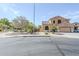 Charming two-story home with a stucco exterior, desert landscaping, and a two-car garage at 6922 S Black Hills Way, Chandler, AZ 85249