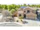 Beautiful two-story home with a neutral exterior, tile roof, desert landscaping, solar panels, and attached garage at 6922 S Black Hills Way, Chandler, AZ 85249