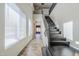 Bright foyer with soaring ceilings, tile floors, a staircase, and natural light from large windows at 6922 S Black Hills Way, Chandler, AZ 85249