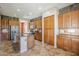 Spacious kitchen featuring an island and wooden cabinets, perfect for cooking and entertaining at 6922 S Black Hills Way, Chandler, AZ 85249