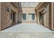 Covered patio area with concrete floor and access to the interior of the house at 6922 S Black Hills Way, Chandler, AZ 85249