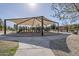 Community playground featuring modern equipment, shaded seating areas, and accessible pathways at 6922 S Black Hills Way, Chandler, AZ 85249