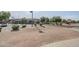 Exterior view of Navarrete Elementary School with well-maintained grounds and ample parking at 6922 S Black Hills Way, Chandler, AZ 85249