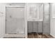 Bathroom featuring a glass-enclosed shower and vanity with storage at 701 S Dobson Rd # 447, Mesa, AZ 85202