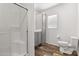 Bathroom with a glass-enclosed shower, vanity, toilet, and storage at 701 S Dobson Rd # 447, Mesa, AZ 85202