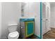 Charming bathroom with turquoise accents, a gray vanity, and a toilet at 701 S Dobson Rd # 447, Mesa, AZ 85202