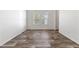 Bright bedroom with a window offering natural light and wood-look flooring at 701 S Dobson Rd # 447, Mesa, AZ 85202