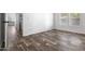 Spacious bedroom featuring durable flooring and natural light from the window at 701 S Dobson Rd # 447, Mesa, AZ 85202