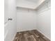 Walk-in closet with wood-look flooring and open shelving at 701 S Dobson Rd # 447, Mesa, AZ 85202