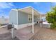 Single-story home with carport and small yard at 701 S Dobson Rd # 447, Mesa, AZ 85202