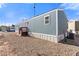 Single-story home with neutral siding and a small covered deck at 701 S Dobson Rd # 447, Mesa, AZ 85202