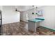 Open-concept living area showcasing a kitchen island, fan and bright, natural light at 701 S Dobson Rd # 447, Mesa, AZ 85202