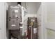 Functional utility room featuring the furnace, water heater, and essential plumbing at 701 S Dobson Rd # 447, Mesa, AZ 85202