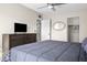 Spacious bedroom featuring a bed, dresser with a TV, and a closet at 735 E Cochise Dr, Phoenix, AZ 85020