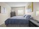 Comfortable bedroom includes a cozy bed, dresser, and a bright window for natural lighting at 735 E Cochise Dr, Phoenix, AZ 85020