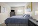 Comfortable bedroom includes a cozy bed, dresser, and a bright window for natural lighting at 735 E Cochise Dr, Phoenix, AZ 85020