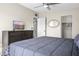 Relaxing bedroom featuring a bed, dresser with a TV, and a closet at 735 E Cochise Dr, Phoenix, AZ 85020