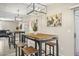 Lovely dining area with an industrial style table with seating for four and mirrored wall at 735 E Cochise Dr, Phoenix, AZ 85020