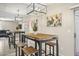 Charming dining area featuring an industrial style table with seating for four and mirrored wall at 735 E Cochise Dr, Phoenix, AZ 85020