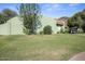 View of the charming single-story home showcasing the yard, landscaping, and roof at 735 E Cochise Dr, Phoenix, AZ 85020