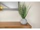 Hallway features a wooden console table with a decorative potted plant and framed mirror at 735 E Cochise Dr, Phoenix, AZ 85020