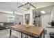 Open floor plan to kitchen and living room from dining area, stainless steel appliances in the kitchen at 735 E Cochise Dr, Phoenix, AZ 85020